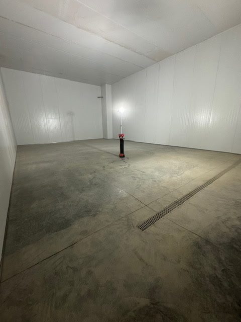 Finished panel room with trench drain